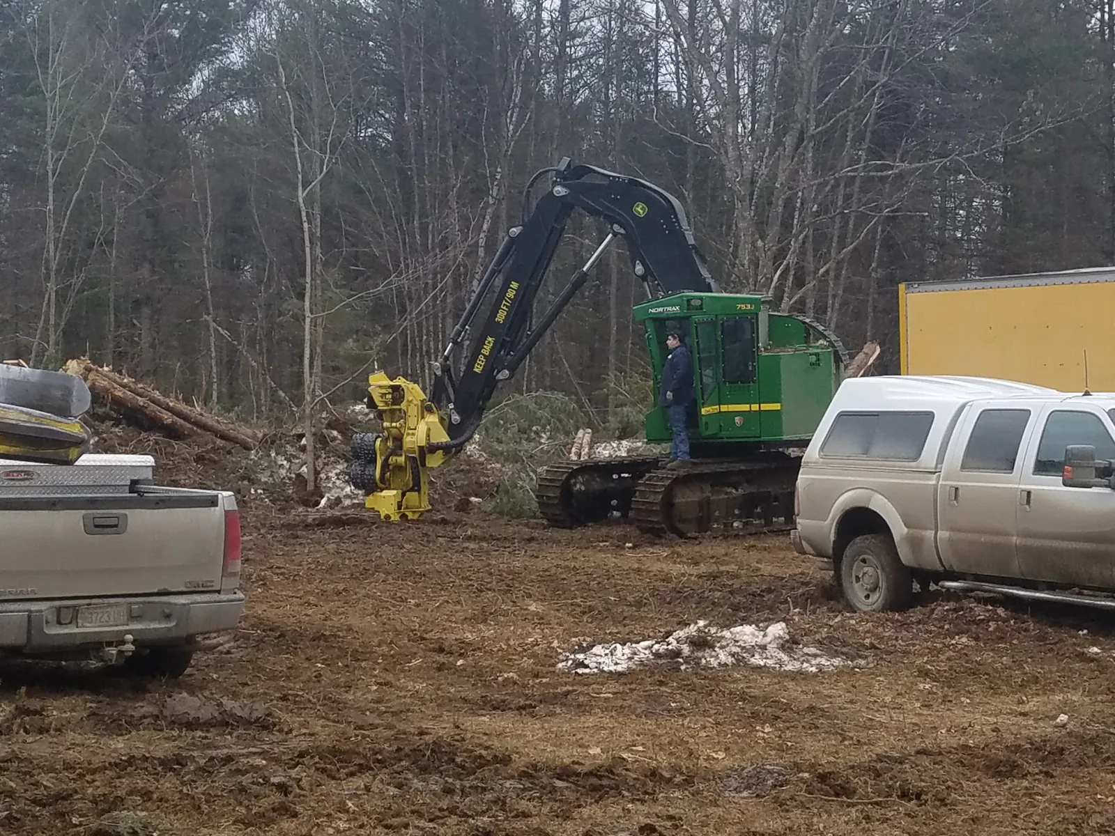 A harvester working at the landing on a managed Maine woodlot